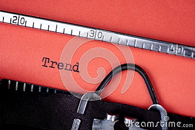 Trend. Text written on a red paper made by old typewriter Stock Photo