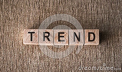 Trend word on wooden blocks on brown background Stock Photo