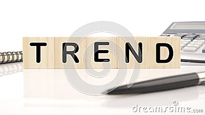 Trend a word written on wooden cubes on a white background. Business, trend or megatrend concept Stock Photo