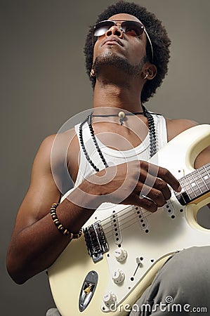 Trendy african guitarist Stock Photo