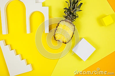 Trendy bright yellow background with geometric forms and podiums for product presentation. Pineapple and podiums to show products Stock Photo
