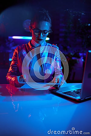 trendy business woman in glasses with tablet PC and laptop Stock Photo