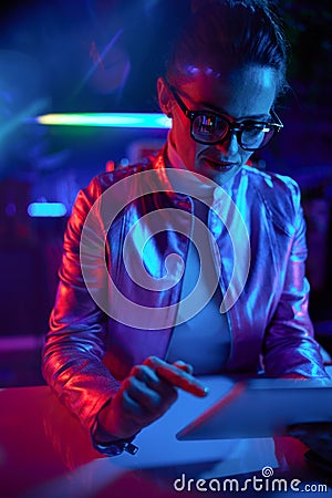 trendy business woman in glasses with tablet PC Stock Photo