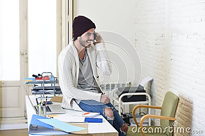 Trendy businessman hipster informal look smiling happy on mobile phone Stock Photo