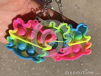 Trendy child rainbow silicone antistress popit toy Stock Photo