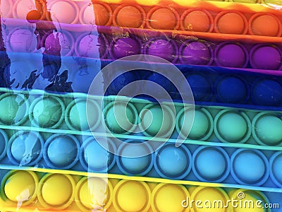 Trendy child rainbow silicone antistress popit toy Stock Photo