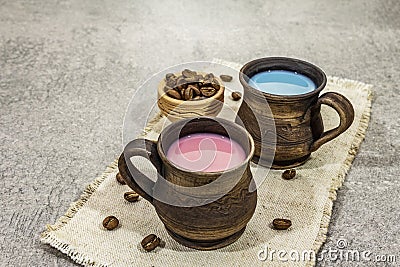 Trendy drink blue and pink latte. Lavender or spirulina and rose, beetroot or raspberry coffee. Stone concrete background Stock Photo