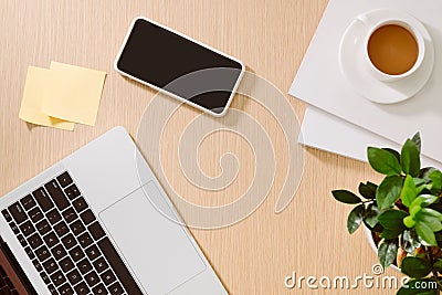 Trendy feminine home office workspace. White office desk. Laptop, coffee cup and phone, notebook, pencil. Flat lay, top view, copy Stock Photo