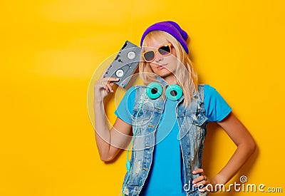 trendy girl in hat with VHS cassette Stock Photo