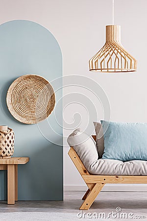 Trendy living room interior with white and blue wall and comfortable couch Stock Photo