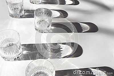 Trendy pattern made with glasses and shadows on gray background. Stock Photo