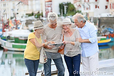 Trendy senior couples together on a trip Stock Photo