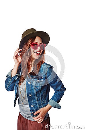 Trendy, style and happy model in a studio with a casual, stylish and funky outfit with accessories. Happiness, smile and Stock Photo