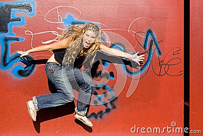 Trendy teenager jumping Stock Photo