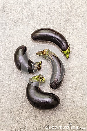 Trendy ugly organic vegetables. Fresh baby eggplants Stock Photo