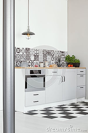 White kitchen interior with elegant wooden cupboards and kitchen accessories Stock Photo