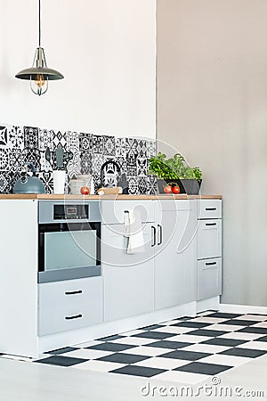 White kitchen interior with elegant wooden cupboards and kitchen accessories Stock Photo