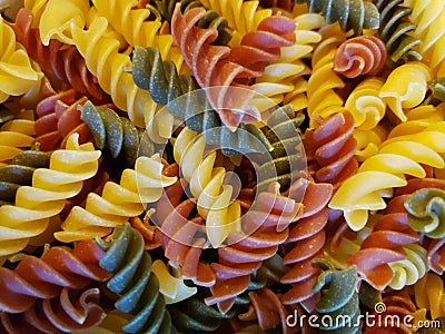 Tri colored spiral pasta uncooked Stock Photo