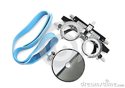 Trial frame and head mirror on white background, top view. Ophthalmologist tools Stock Photo