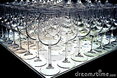 Triangle of empty wine glasses rows for tasting arranged at a wine show. Stock Photo