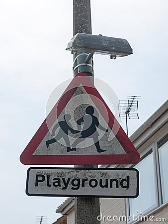 Triangle playground sign in street close up Stock Photo