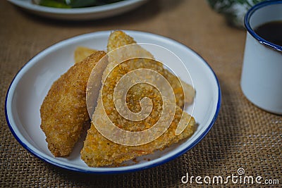 Triangle shape rissole with vegetable or sausage and mayonnaise filling Stock Photo