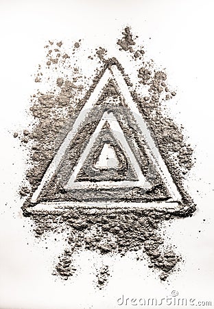 Triangle shape symbol drawing in dust as order in chaos Stock Photo