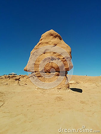 Triangle shaped hoodoo rock formation in Goblin Valley Stock Photo