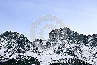 Triangle shaped snow cap mountain in the Polish Tatrah Stock Photo