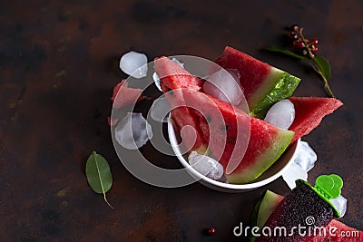 Triangle shaped watermelon slices placed with ice Stock Photo