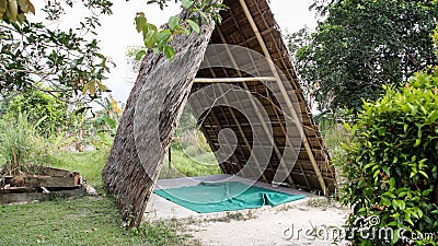 Triangle traditional thatch or nipa gazebo hut a place to relax with a rural atmosphere Stock Photo