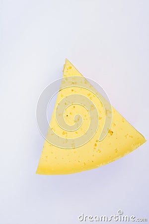 Triangular Chunk Wedge of Alpine Creamy Appetizing Light Yellow Tilsit Cheese on White Background. Texture with Cracks and Holes Stock Photo