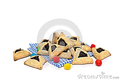Triangular cookies with poppy seeds hamantasch or aman ears , candy for jewish holiday of purim celebration on white background Stock Photo