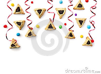 Triangular cookies with poppy seeds hamantasch or aman ears , colored candy and red serpentine for jewish holiday of purim Stock Photo