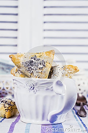 Triangular cookies with poppy seeds Stock Photo