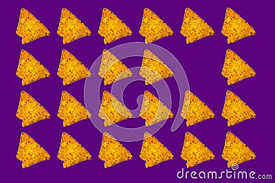 Triangular nachos on purple color background Stock Photo