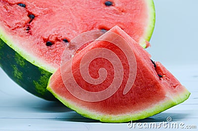 Triangular piece of watermelon and cut in half a watermelon Stock Photo