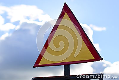 Triangular road sign on a background of sky Stock Photo