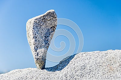 Triangular rock balanced on the tip Stock Photo