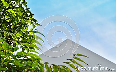 Triangular roof and blue sky Stock Photo