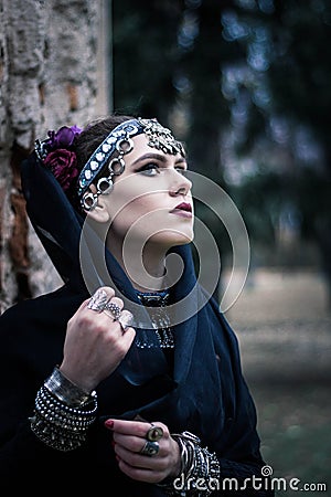 Tribal woman portrait outdoors in autumn trees Stock Photo
