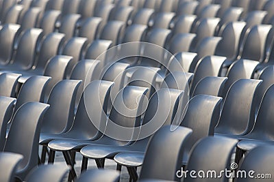 Tribune at the stadium with a large number of grey seats Stock Photo