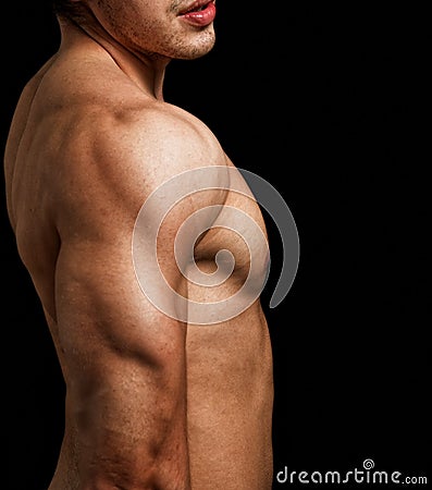 Triceps and shoulder of man with muscular fit body Stock Photo