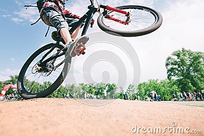 Tricks on the bike. young man jumps on a mountain bike. Cycling Sports Concept Stock Photo