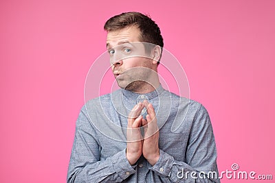 Tricky mature man thinking looking with hand together over pink background Stock Photo