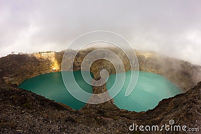 Tricoloured lakes in caldera of Kelimutu Volcano. Stock Photo