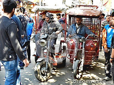Tricycle drivers waiting for customers in Chandni Chowk, Old Delhi. Editorial Stock Photo