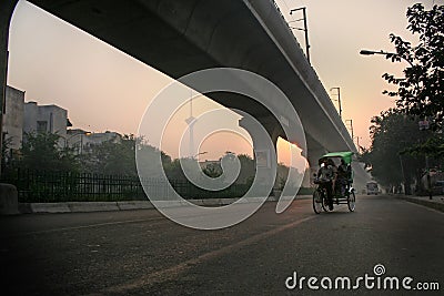 Tricycle rickshaw, pedicab, new delhi misty morning sunrise Editorial Stock Photo