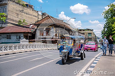 Tricycle Tuk Tuk runs on the streets of Bangkok, Thailan Editorial Stock Photo