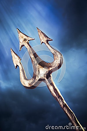 Trident on a dramatic background Stock Photo
